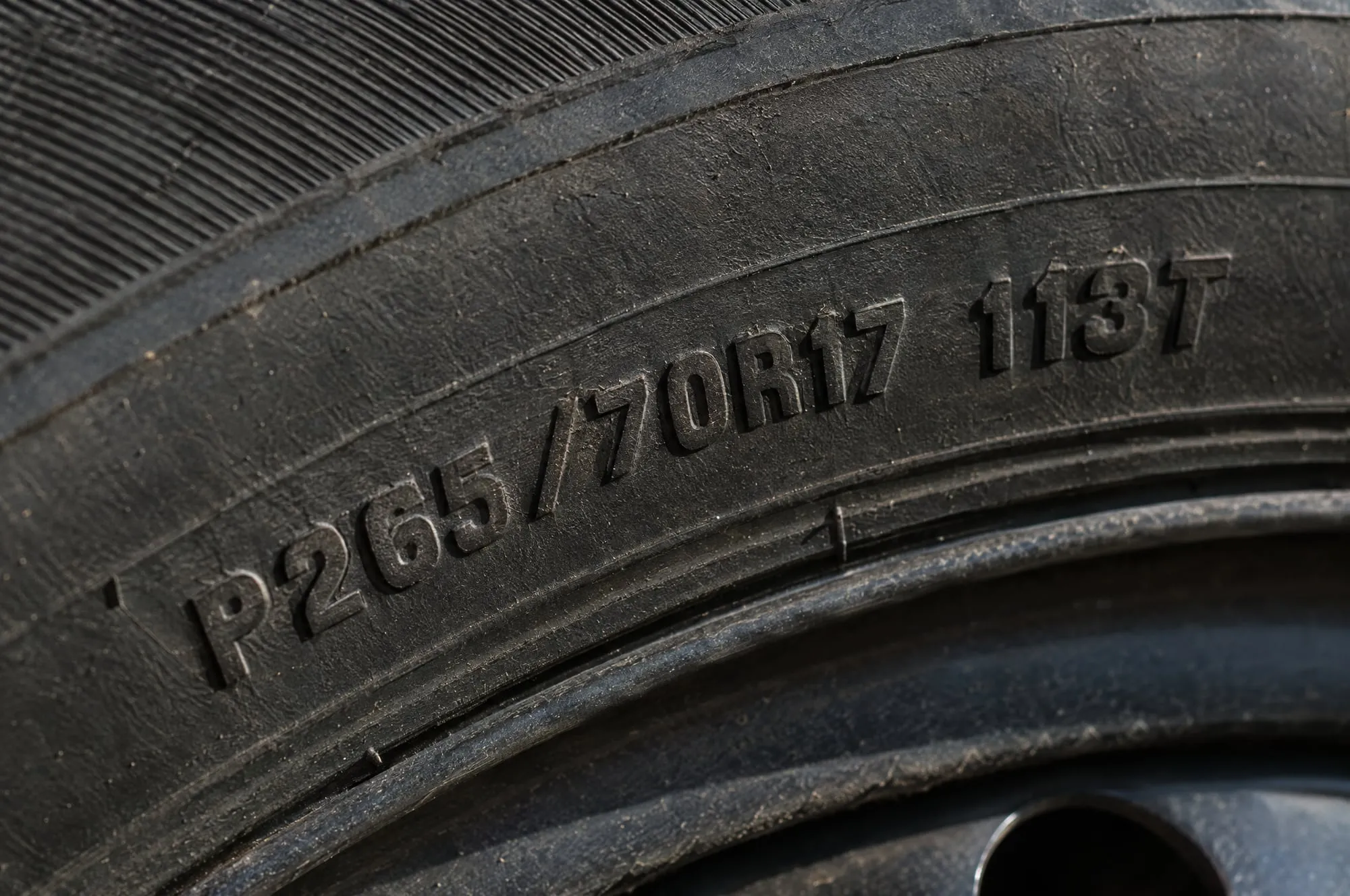 Tire sidewall showing the size code P265/70R17 113T